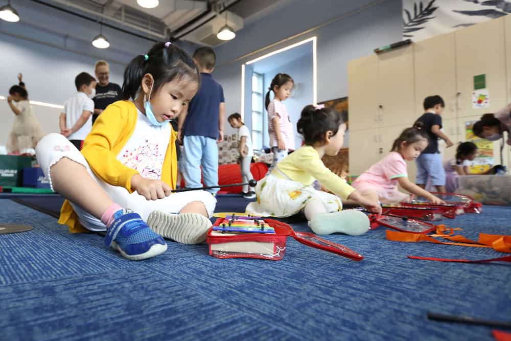 Young students at Concordia playing music to promote healthy brain development