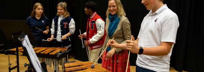 Latest news from TASIS - October, 2022 14 Students performing music with xylophones at a world schools event.