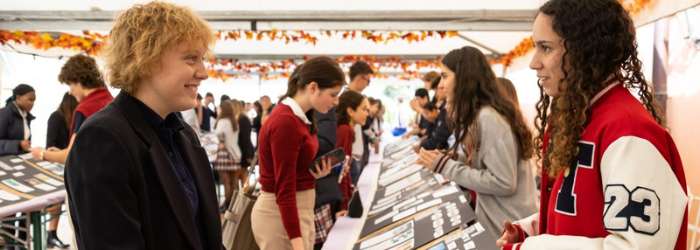Latest news from TASIS - October, 2022 16 International students interacting at World Schools education fair, showcasing global school opportunities.