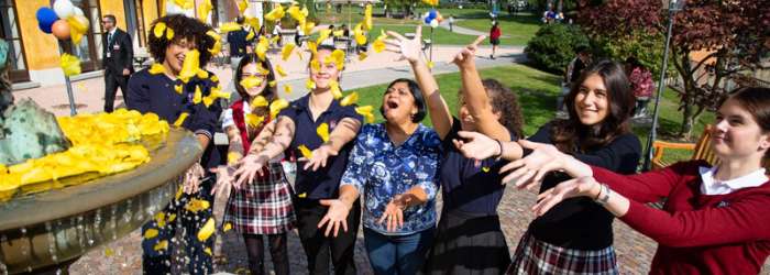 Latest news from TASIS - October, 2022 8 Children celebrating outdoors at a World Schools event with colorful decorations and joyful expressions.