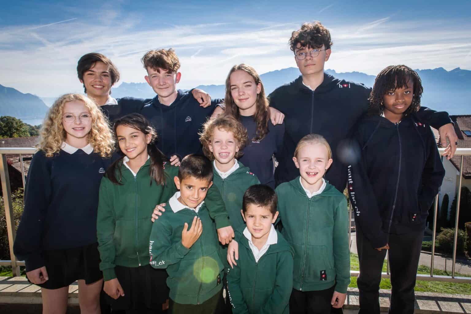 Group of diverse students at Haut-Lac International Bilingual School outdoors.