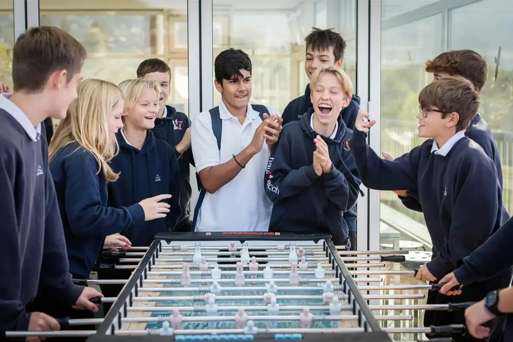 Students playing table football at Haut-Lac International Bilingual School.