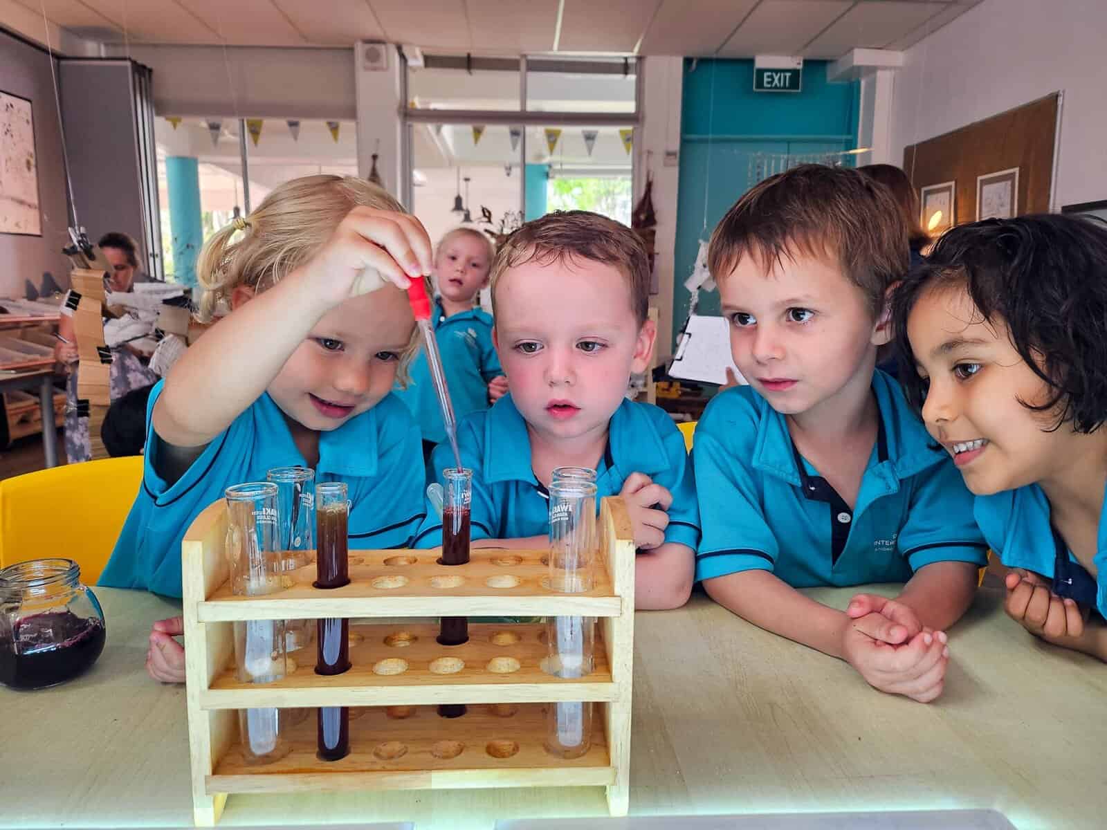 Children conducting science experiments in a classroom at Dover Court International School.