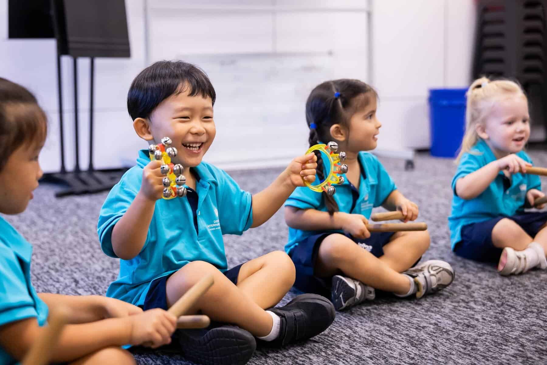 Young students engaging in classroom activities at Dover Court International School.
