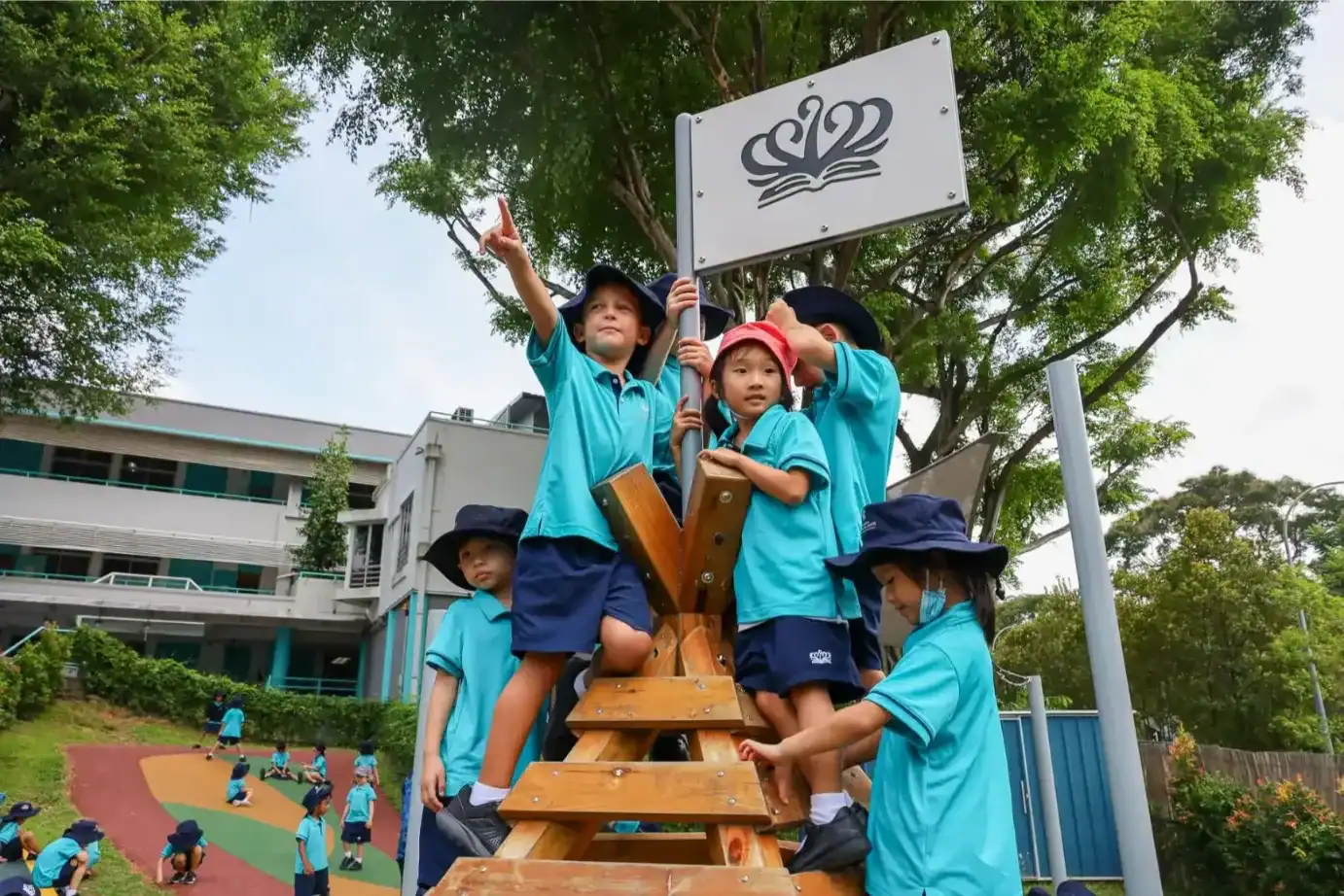 Children playing on outdoor climbing structure at Dover Court International School.