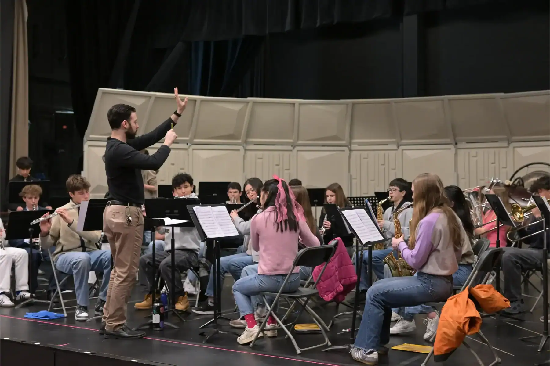 Music class at the International School of Brussels with students practicing instruments.