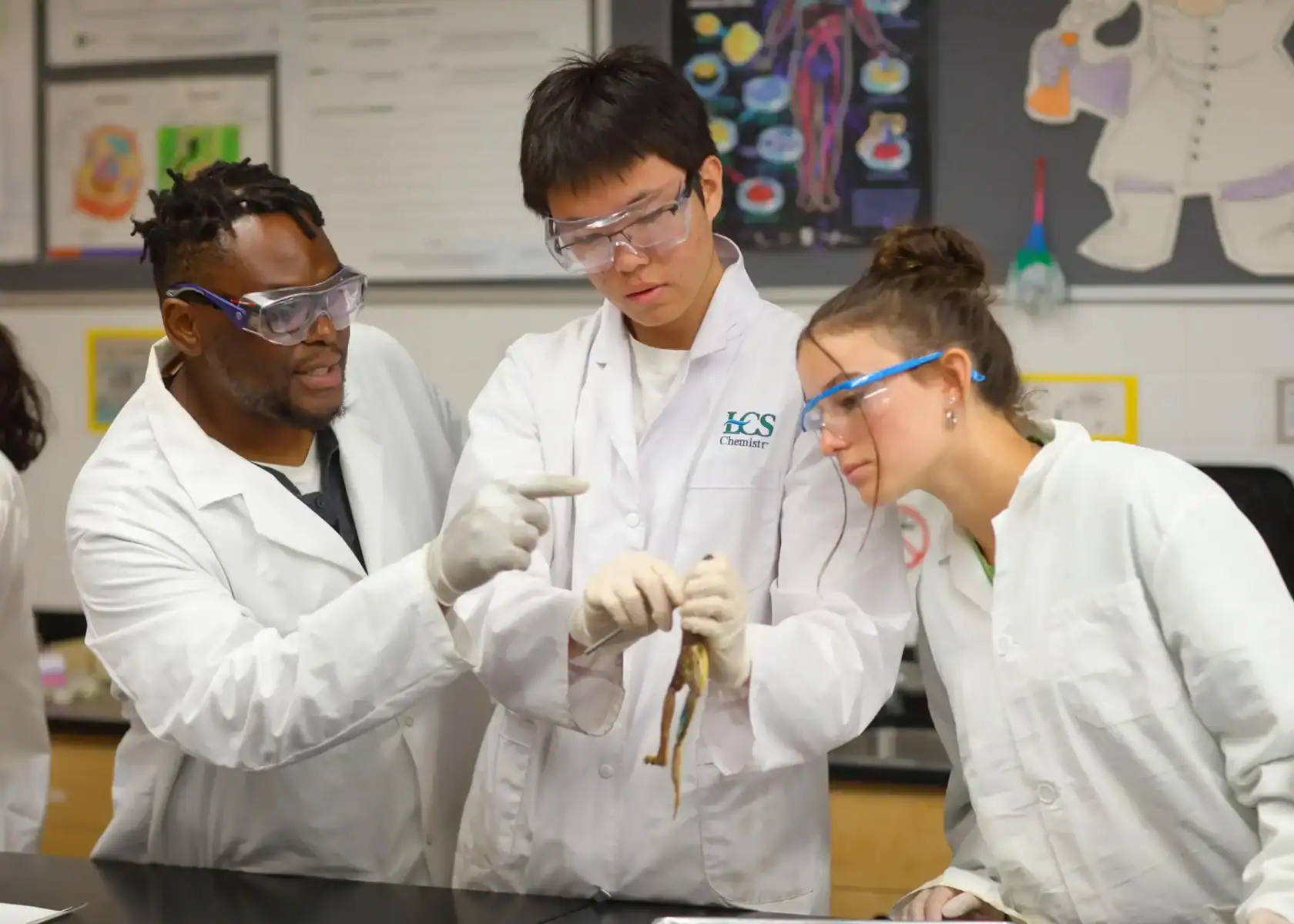 Students conducting science experiment in a modern classroom at Lakefield College School.