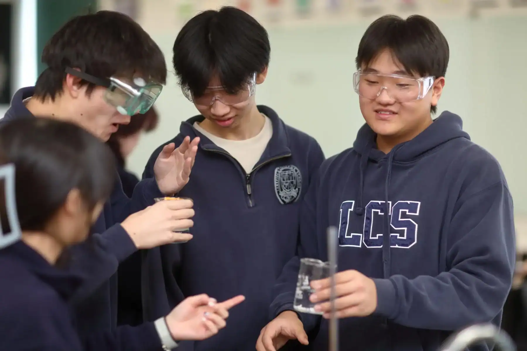 Science students conducting experiments in a classroom at Lakefield College School.