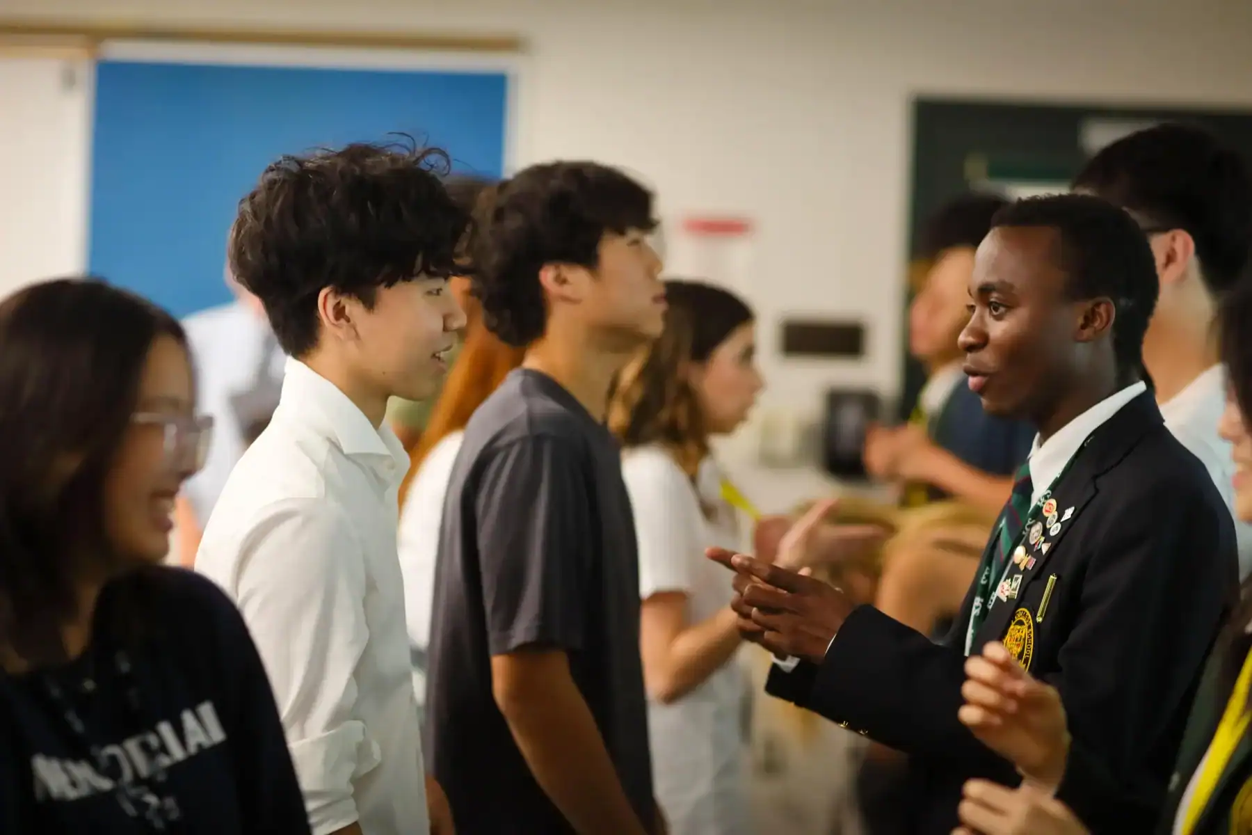 Diverse students engaging in a school discussion at Lakefield College School.