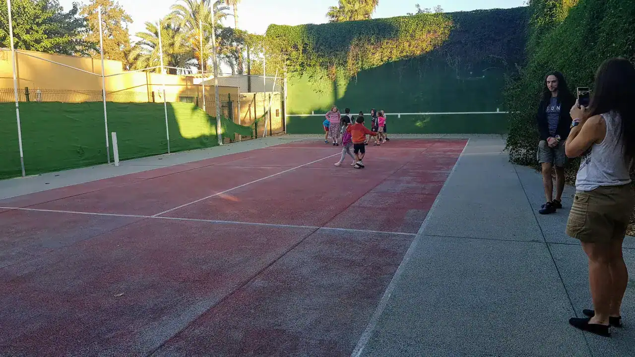 Children playing on school sports court at World Schools for global education.