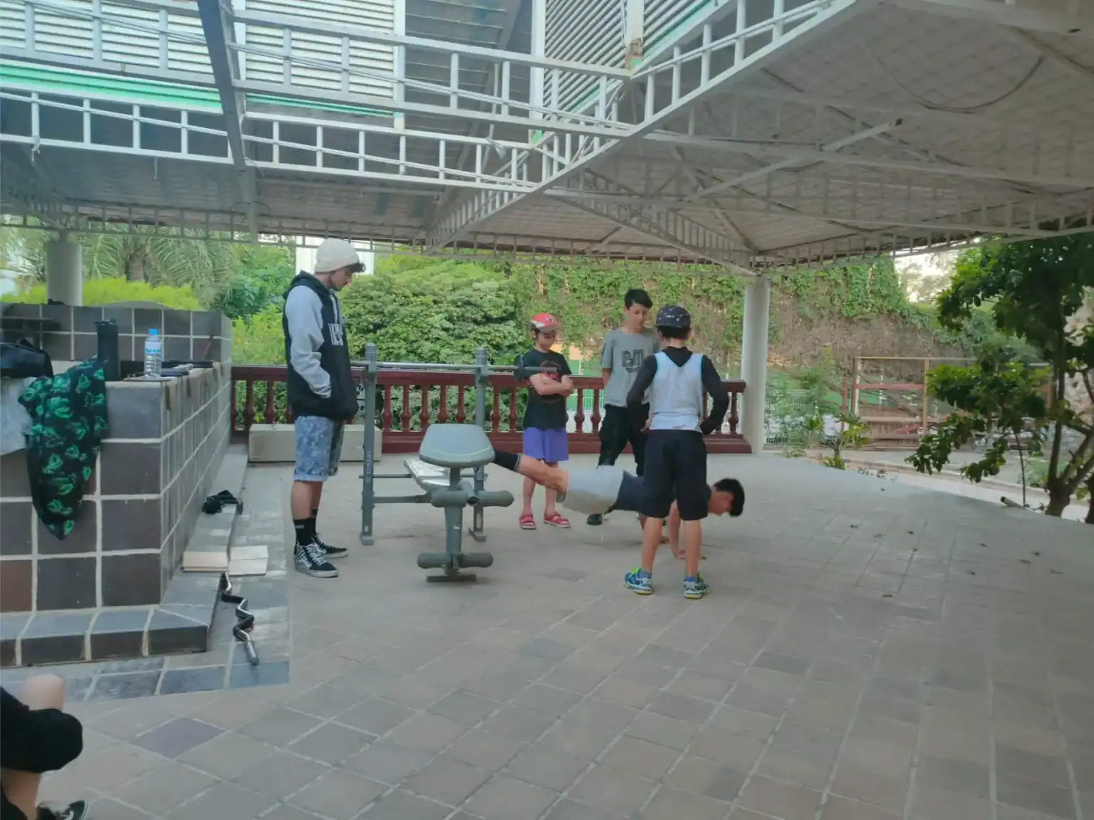 Outdoor kids' fitness activity at a modern school, promoting health and wellness in education.