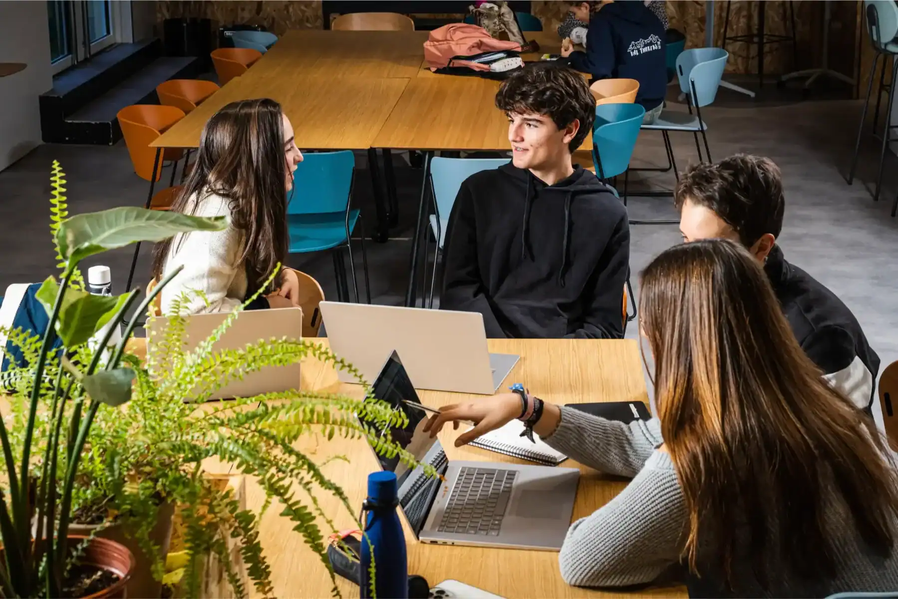 Students collaborating in a modern classroom at The Global College.