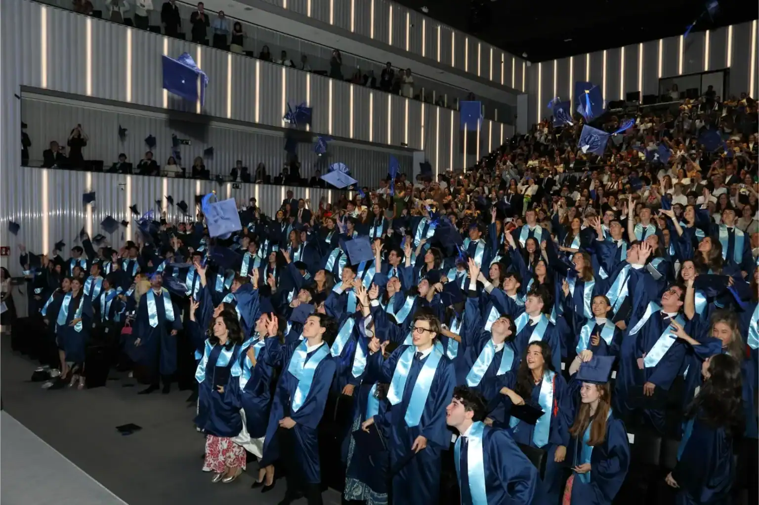 Graduates celebrating at The Global College graduation event, showcasing international students in a.