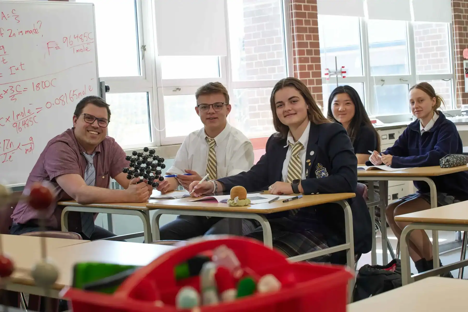 Students in a classroom at Trinity College School engaging in science activities.