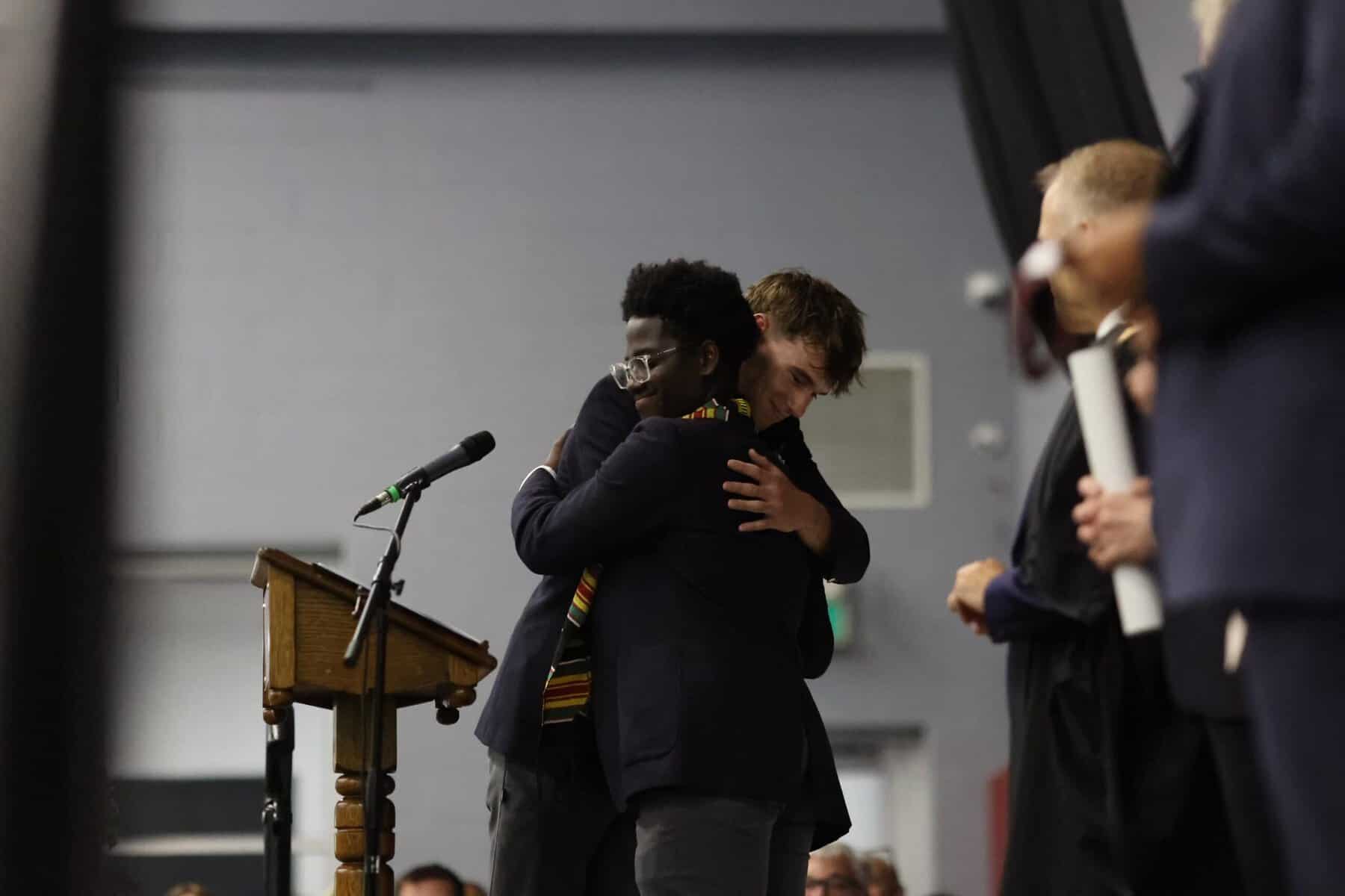 Students embracing during a school event at Trinity College School.