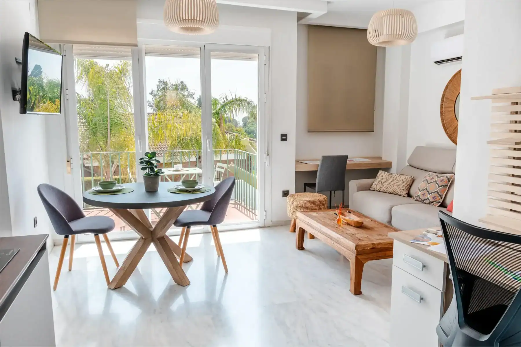 Bright living room with large windows, modern furniture, and a cozy atmosphere at The British School.