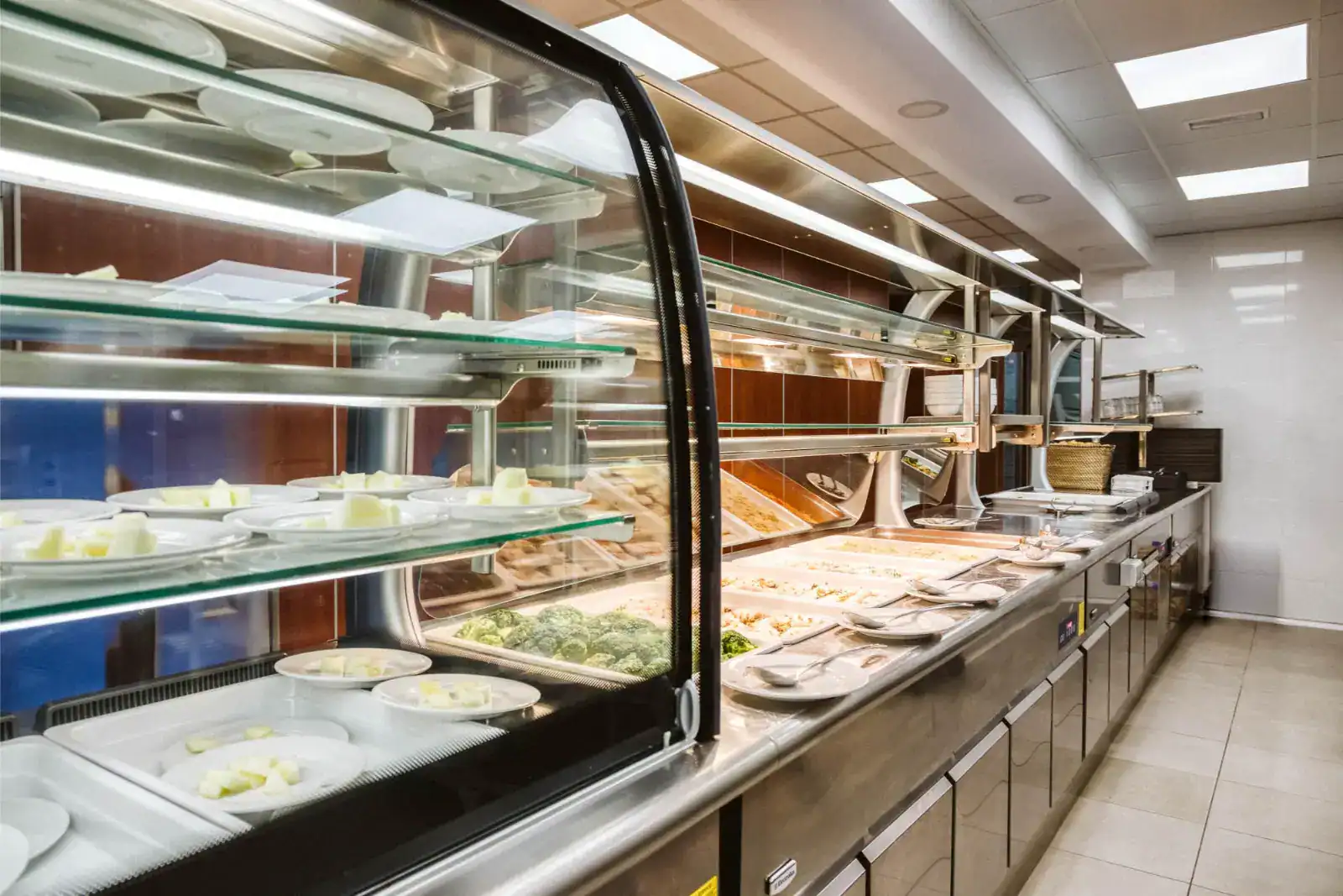 Fresh school cafeteria meal options with nutritious food displays at a modern school dining area.