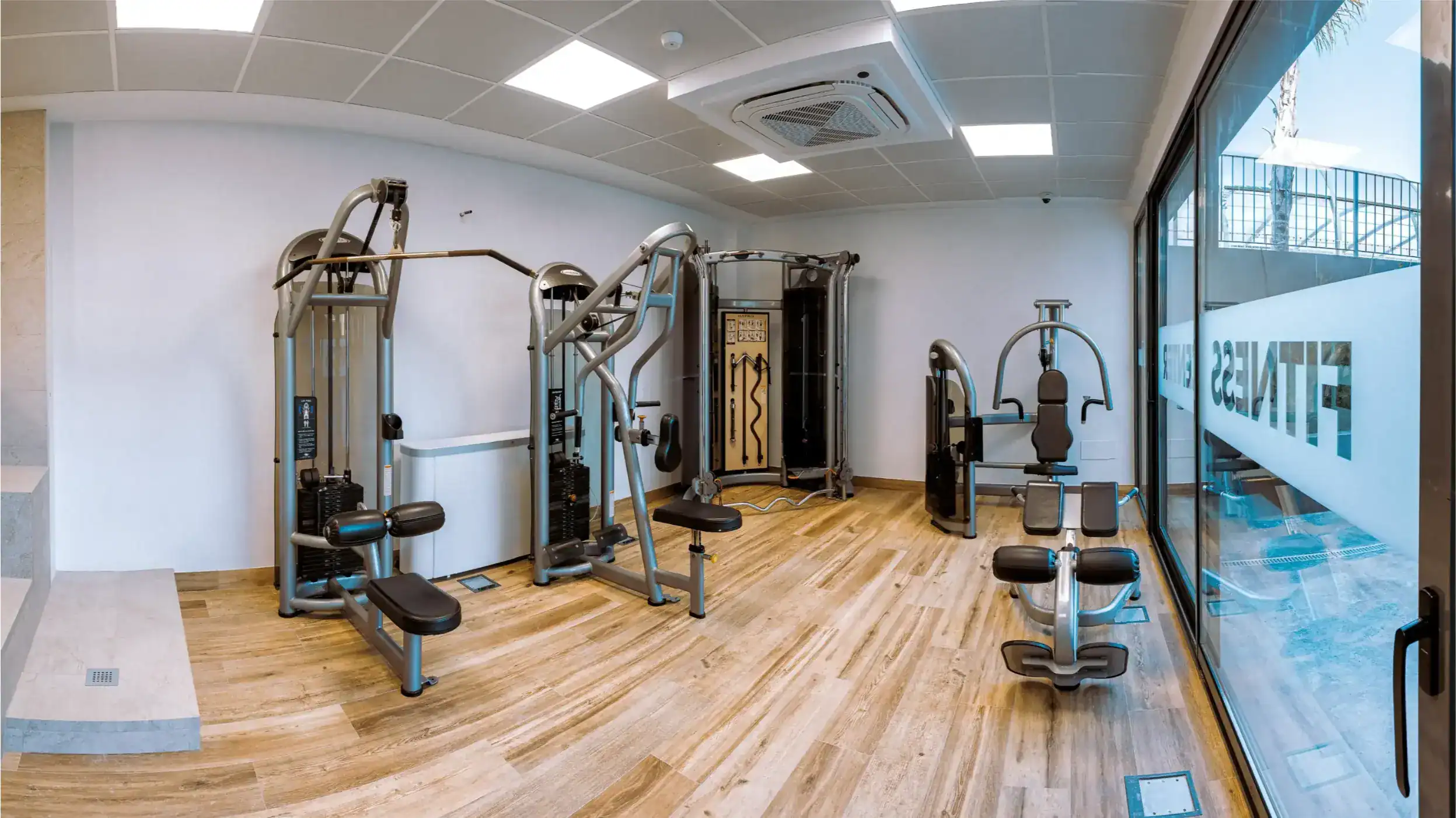 Modern school gym with fitness equipment for student health and wellbeing.