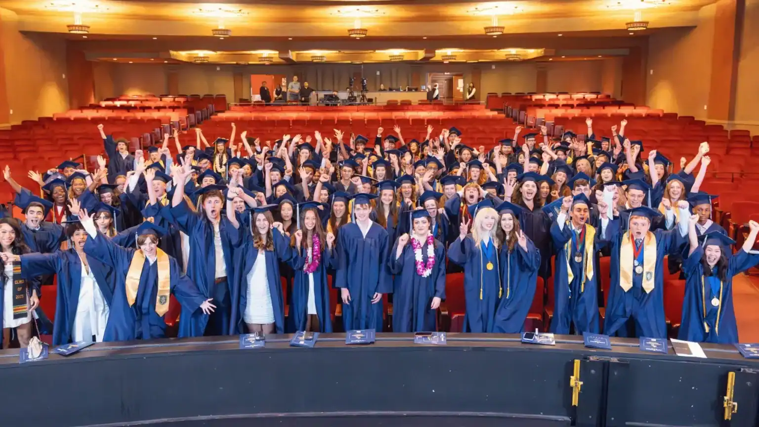 Graduates in caps and gowns celebrating at Laurel Springs School graduation event.