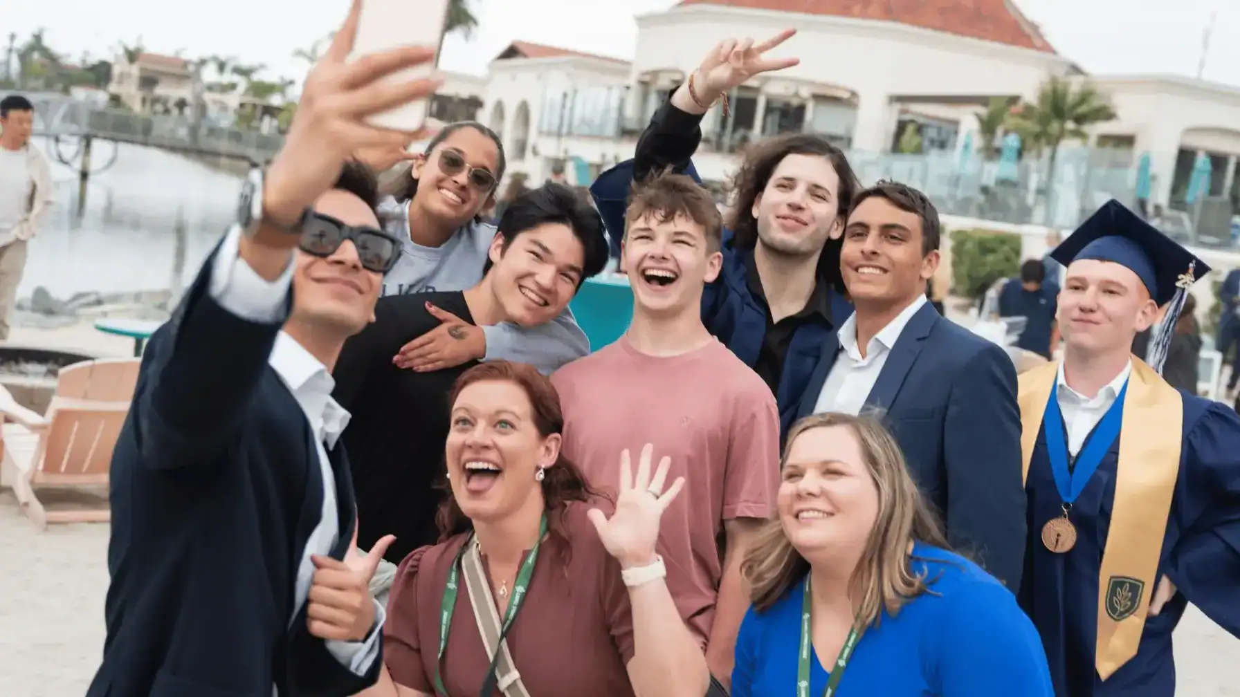 Students celebrating graduation outdoors at Laurel Springs School.