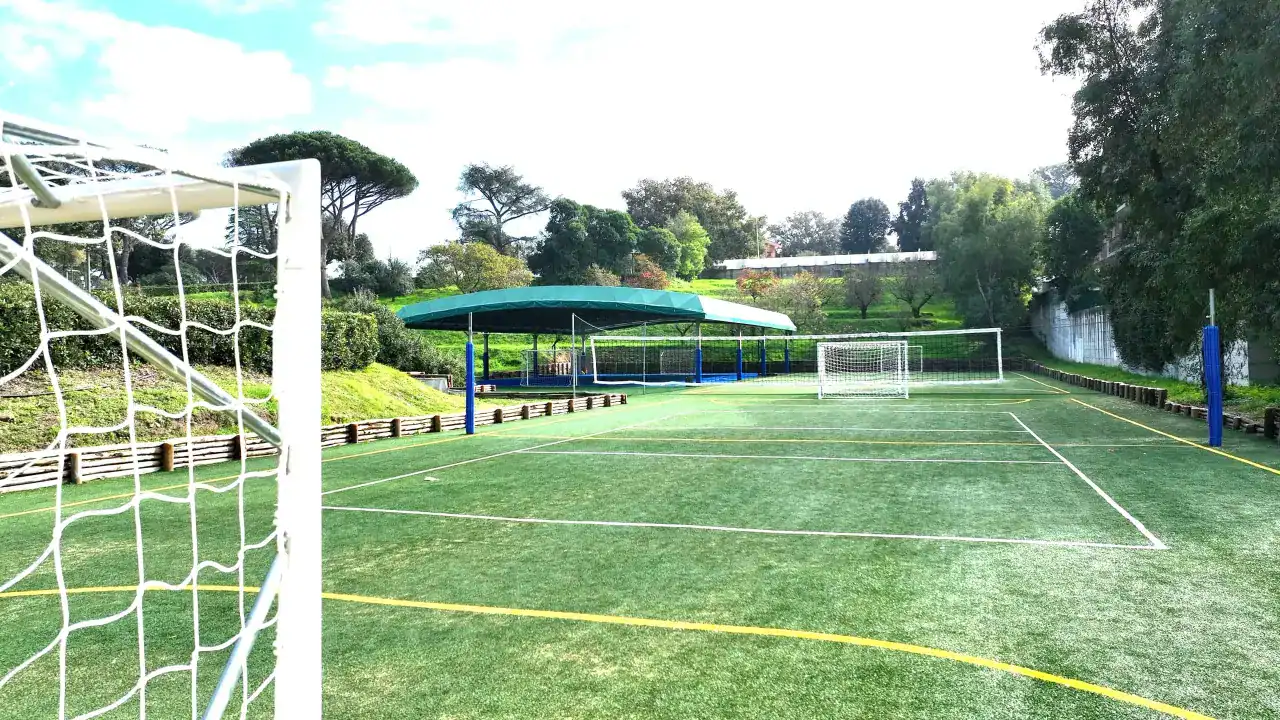 Vibrant outdoor soccer field at World Schools sports complex with well-maintained turf and scenic surroundings.