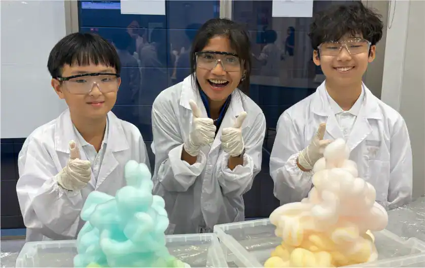 Science students conducting experiments with colorful chemical reactions.