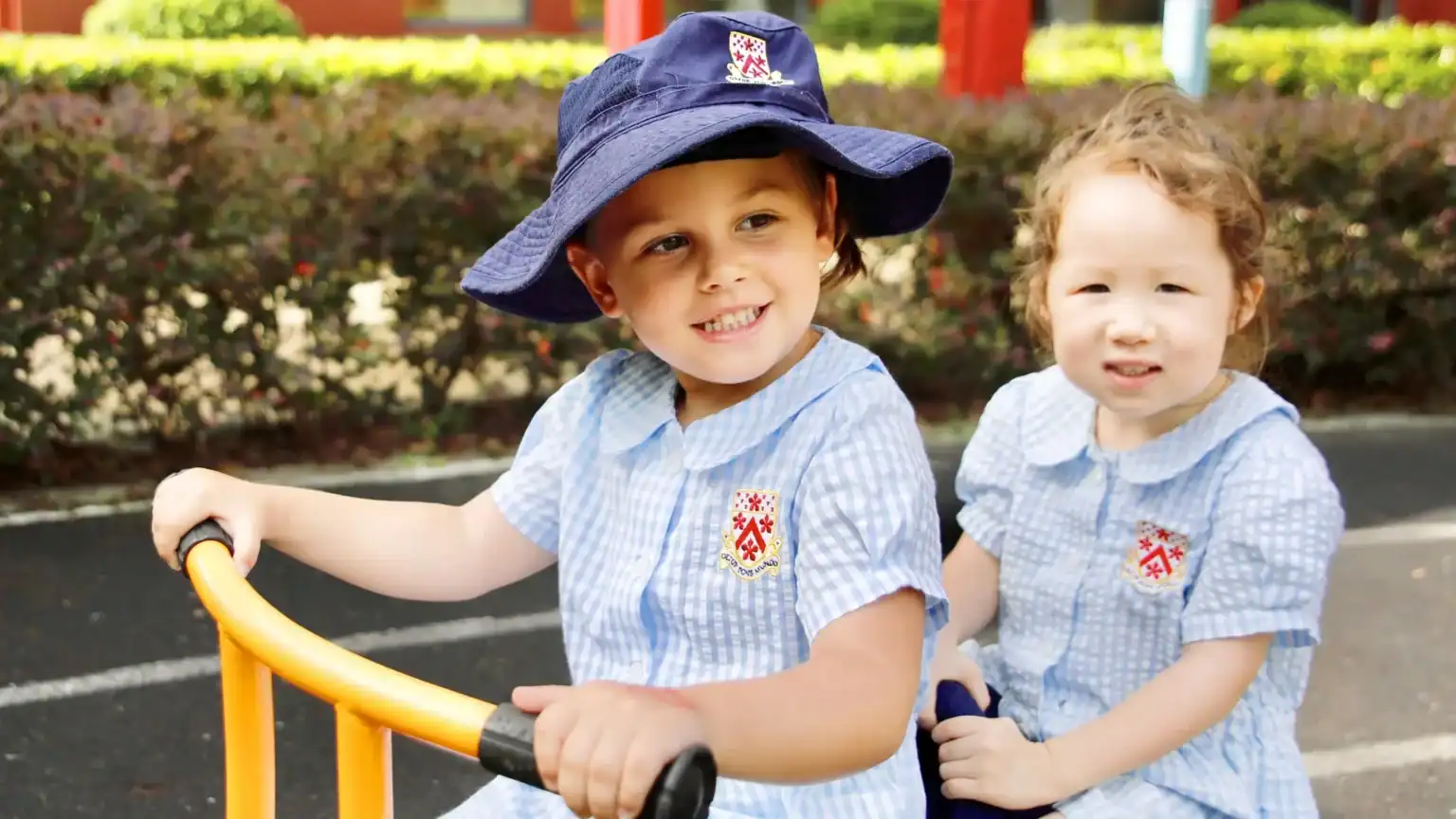 Happy children playing outdoors at Dulwich College Shanghai Pudong.