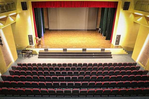 Theatre hall with stage and seating at Dulwich College Shanghai Pudong, a leading international scho.