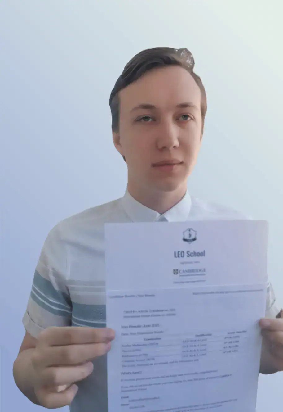 High school student holding academic achievement certificate at World Schools celebration.