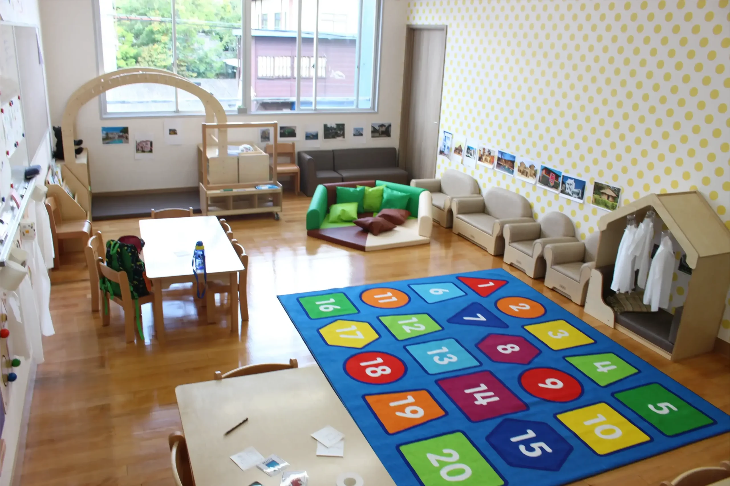 Bright early childhood learning classroom in a world schools setting with colorful educational play area.