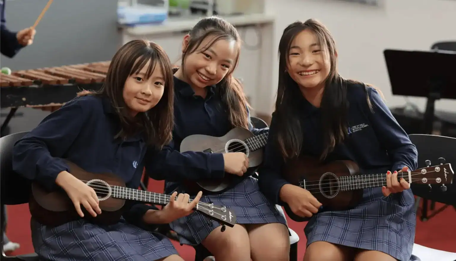 Innovative international school students enjoying music class at World Schools, fostering creativity and cultural diversity.