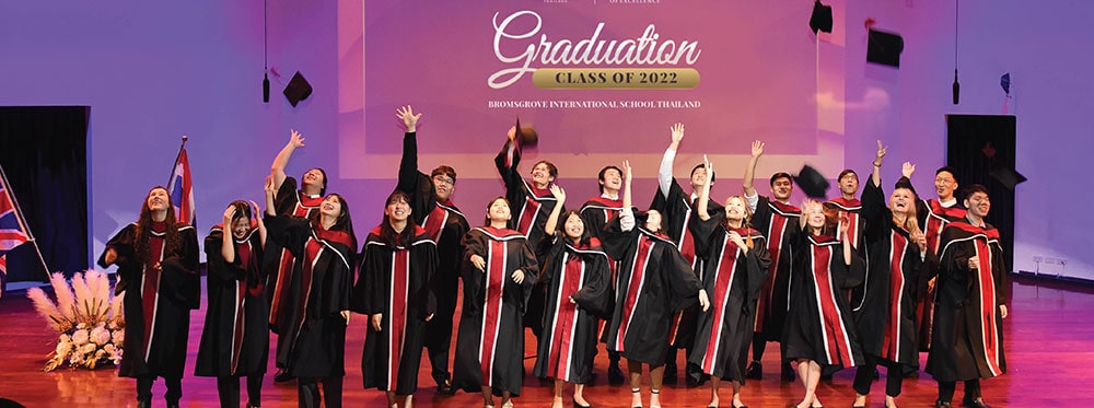 1. diverse group of graduates in black robes celebrating graduation on stage 2. happy students celebrating graduation at World Schools 3. students in academic caps and gowns celebrate graduation ceremony at World Schools, showcasing success and achievement.