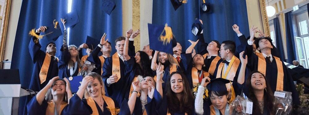 Graduates celebrating at a World Schools graduation ceremony, showcasing excellence in international education.