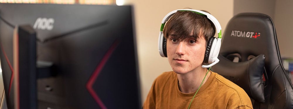 Professional student gaming at an esports-focused international school.