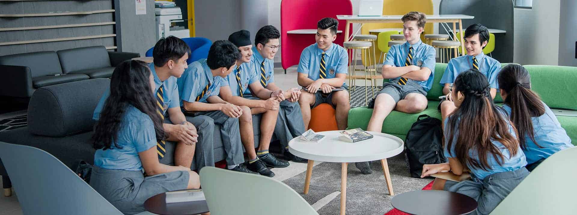 Students engaging in a group discussion at a World Schools educational environment.
