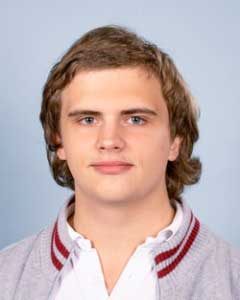 Latest news from TASIS - October, 2022 1 Bright teenage male student with school uniform and confident expression.