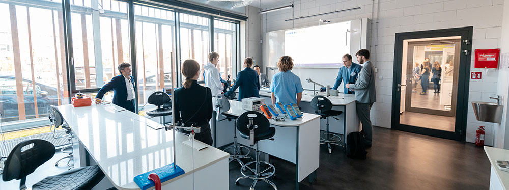 Bright modern classroom at World Schools with students and teachers collaborating.