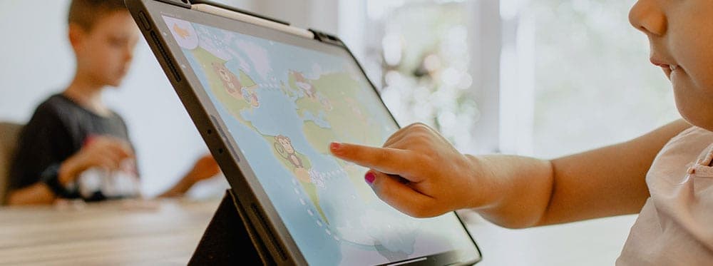 Interactive learning with digital tablets at World Schools for global education.