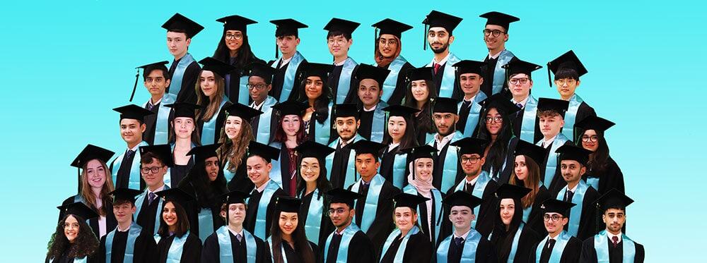 Graduates in caps and gowns celebrating at a World Schools graduation ceremony.