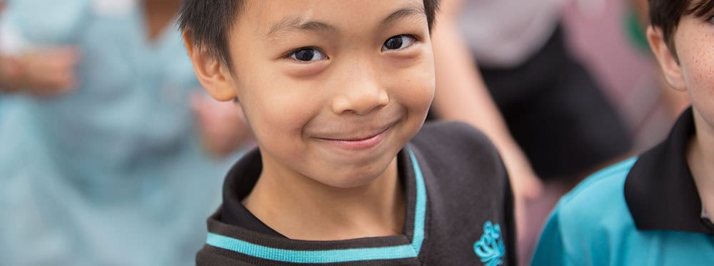 Bright young student at an international school, highlighting global education excellence.
