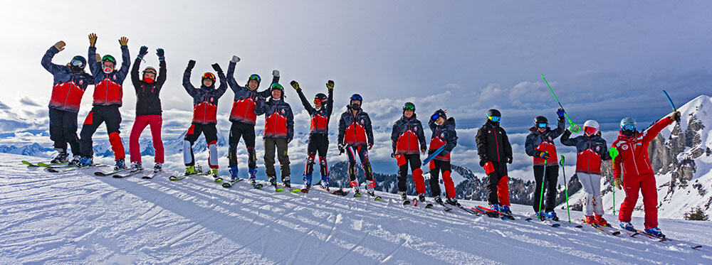 Kids skiing ski school winter snow mountain scenery outdoor activity for education and adventure travel.