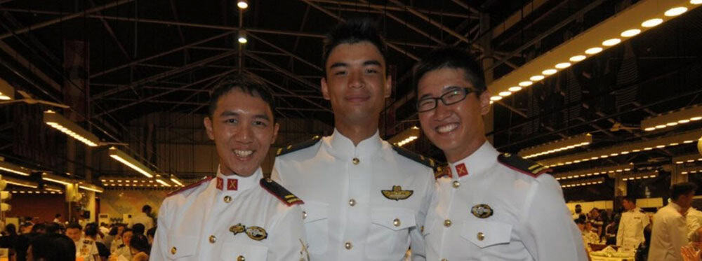 Diverse students in military dress uniforms at an international school event, promoting global education excellence.