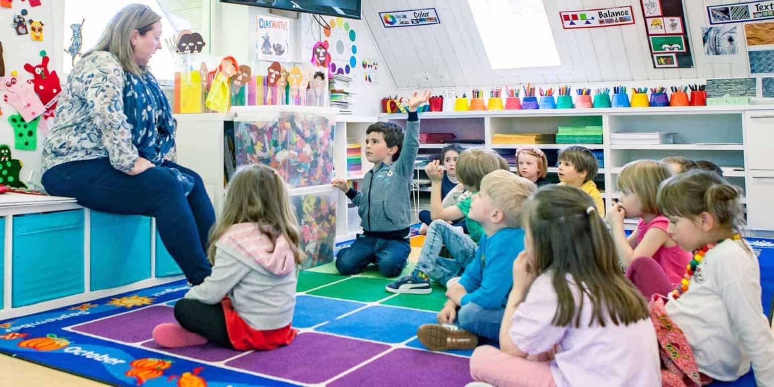 Colorful classroom with young children engaging in a learning activity, fostering creative and academic skills.