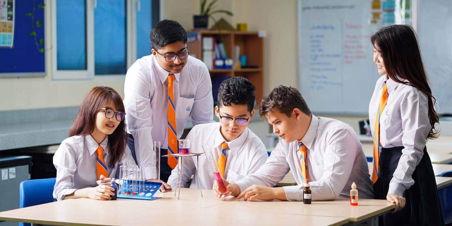 Highly motivated students conducting science experiments in a modern classroom setting.