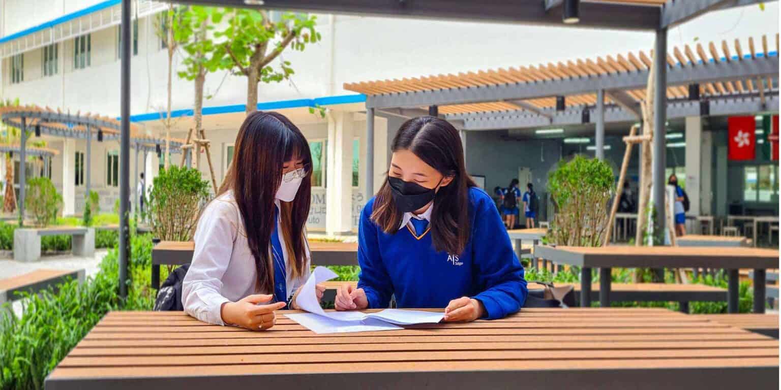 Students studying outdoors at innovative World Schools campus for quality education and global learning.