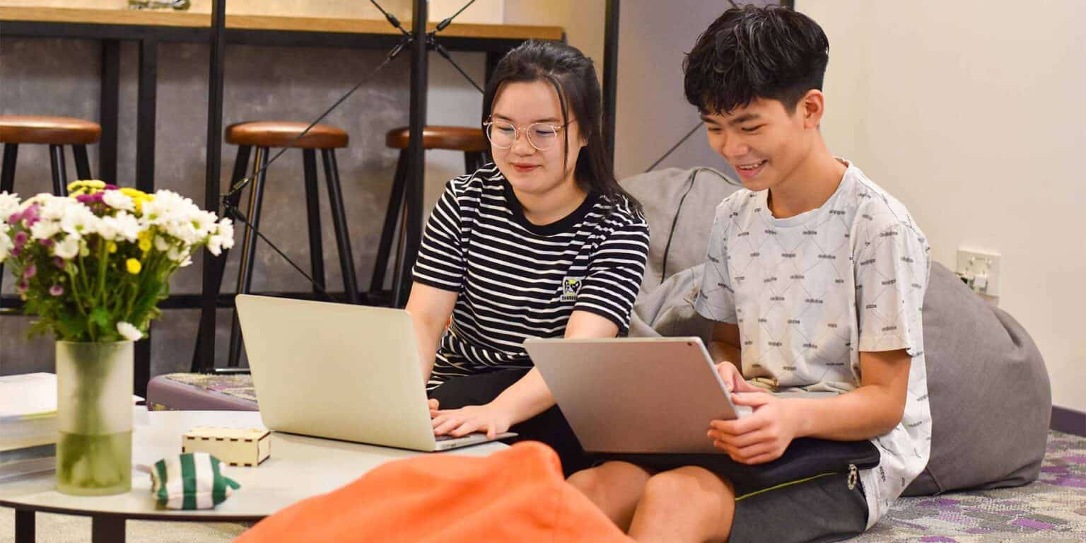 Young students engaged in collaborative learning at a modern school setting.