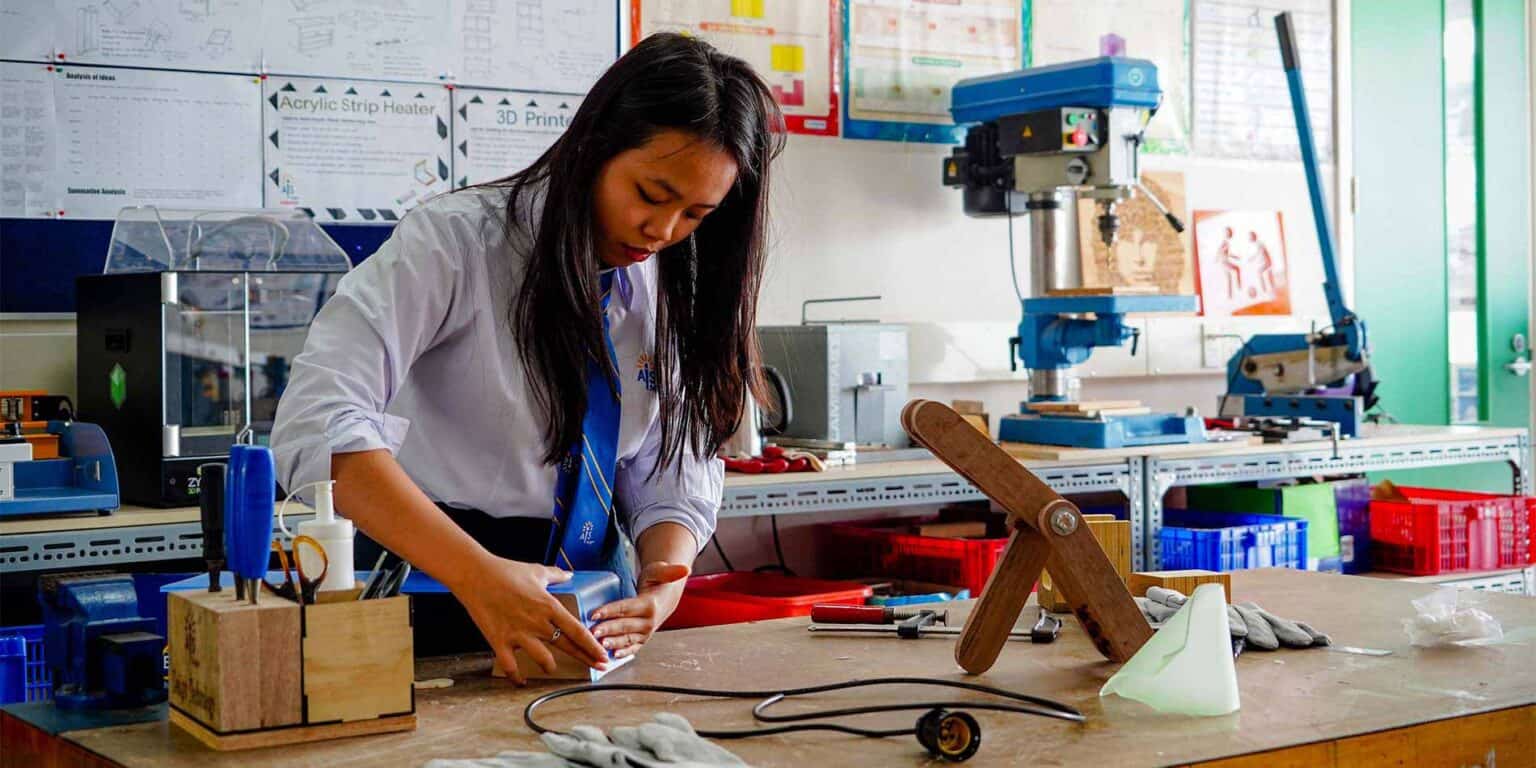 Innovative student working on engineering project at a modern school science lab for World Schools.