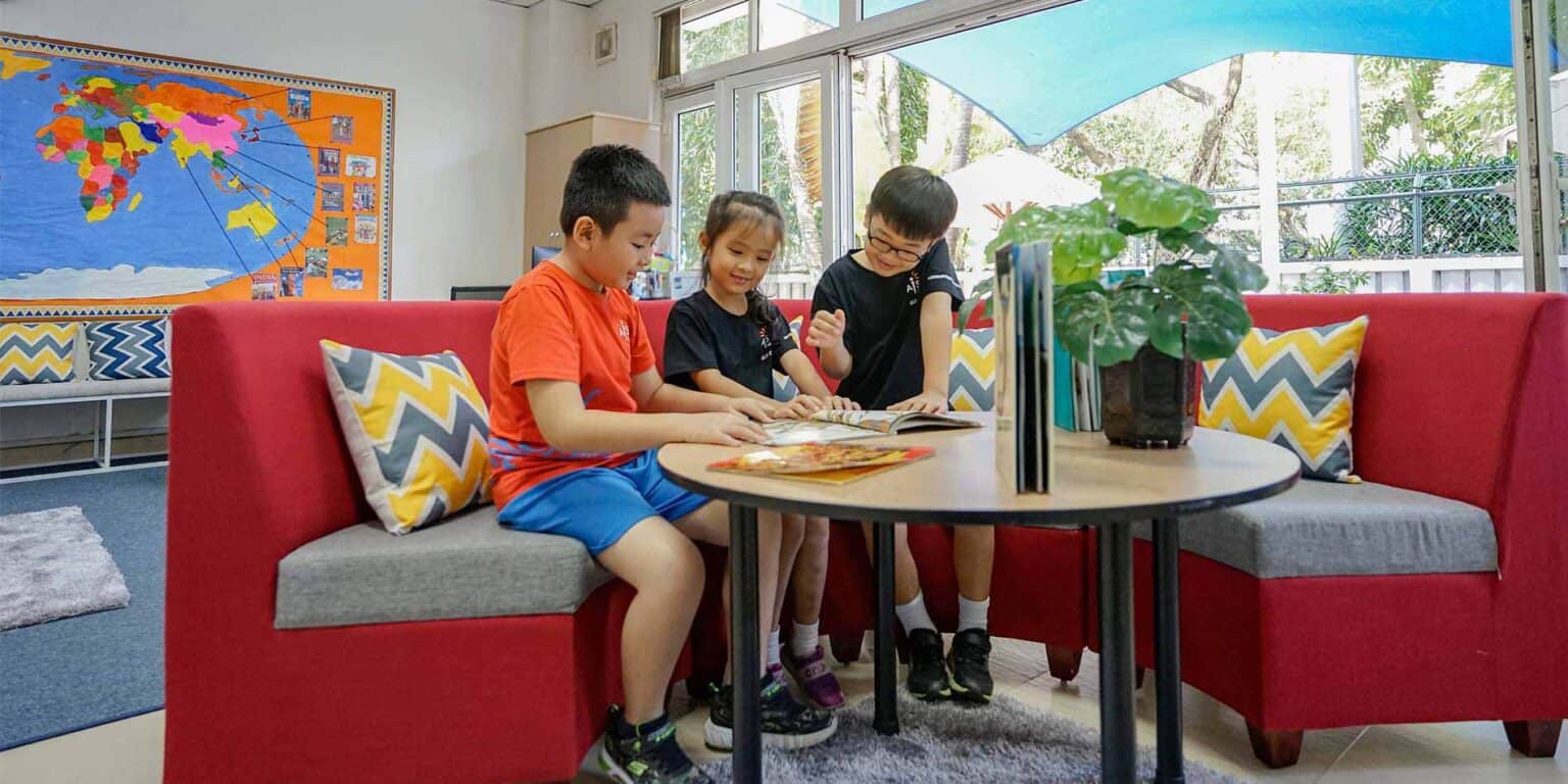 Children studying together in a bright, modern classroom at World Schools.
