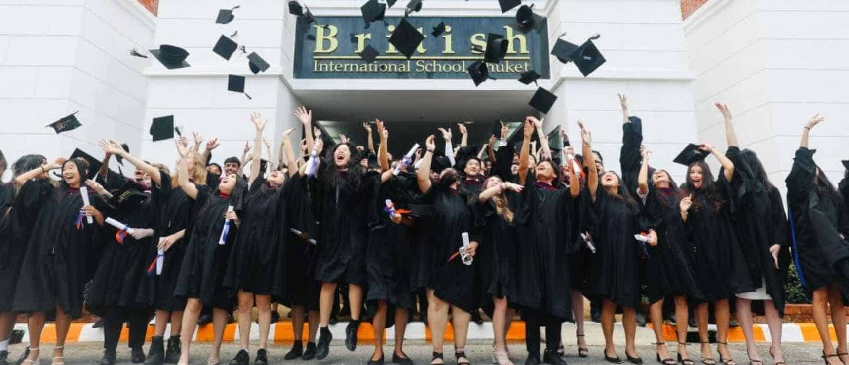 Graduate students celebrating graduation at British International School in Phuket, Thailand.