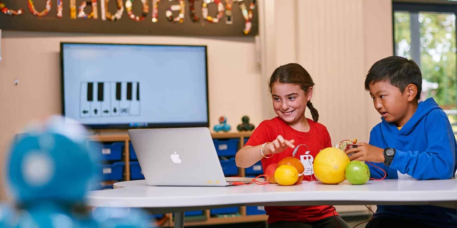 Innovative world schools fostering STEM education with technology and interactive learning environments, promoting student creativity.